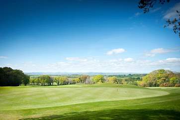 The golf course at Woodbury Park Country Cub - a stunning setting overlooking the Exe Valley with the hills of Dartmoor beyond.