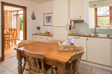 The delightful kitchen leads into the dining area.