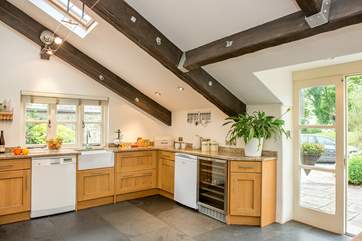 Large patio doors lead out to the terrace and garden