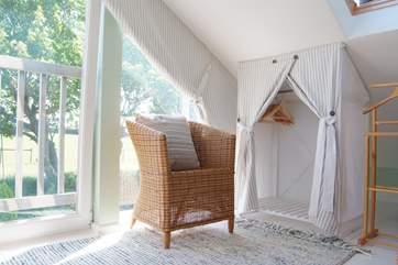 A clever tucked-away storage space for clothes.