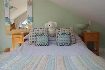 The bed is low due to the limited headroom, but very comfortable and dressed with lovely linens.