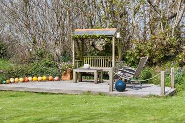 The gorgeous decked area has easy back chairs, perfect for an afternoon nap in the sun.
