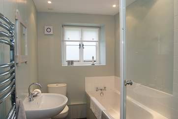 The well appointed bathroom also has a separate shower cubicle.