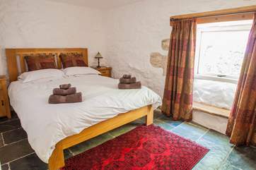 The lovely double bedroom has slate floors and a 5' double bed (Bedroom 1).