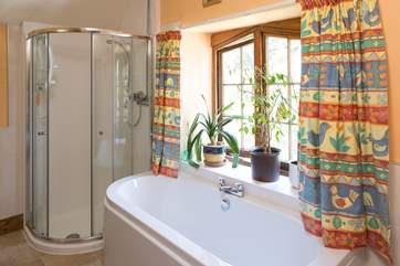 The first floor bathroom looks out over the garden.