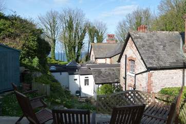 The patio at the top of the garden has views of the sea.