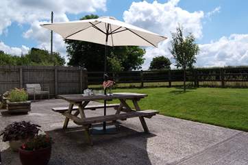 There is a sunny patio and a large fully enclosed garden with a paddock beyond. This place is ideal for young children and guests who wish to bring a dog.