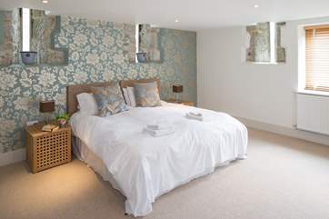 The spacious master bedroom has 'zip and link' beds, which can be set up as twins or a 6' double, and en suite shower-room.