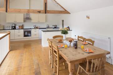 The dining-area is in the middle section of this contemporary open plan space.
