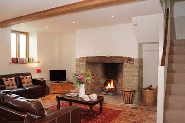 The open fire adds even more character to this lovely barn conversion.
