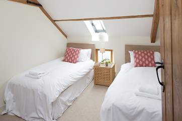 The bright twin bedroom.