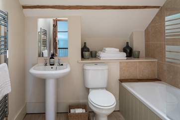 The family bathroom in Dairyman's Cottage is fresh and contemporary.