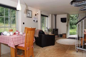 Looking across the living-area from the other direction. There is a wood burning stove for cosy evenings in.
