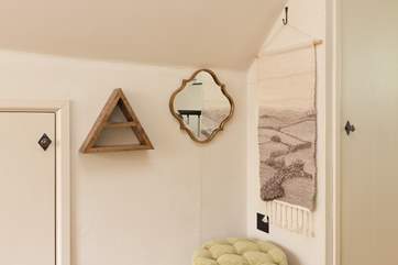 There is even a thoughtful corner in the bedroom with mirror, make-up shelf and stool.