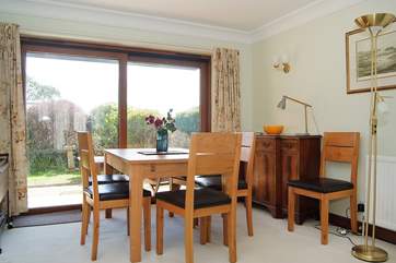 The dining area with sliding doors onto the sunny patio area.