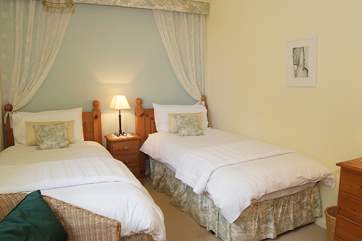 The pretty twin bedroom.