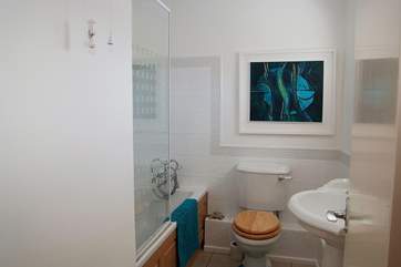 The Owner's artwork can even be found in the smallest room in the house.