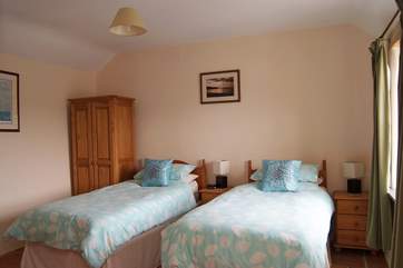 The ground floor bedroom has 'zip and link' (double or twin) beds, and access to the bathroom next door (Bedroom 1).