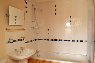 The ground floor bathroom can be accessed from both the hall and Bedroom 1.