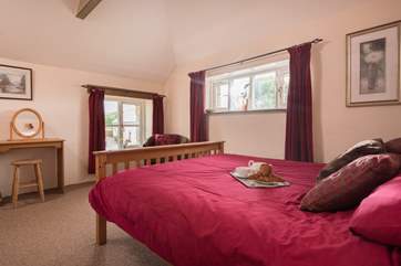 The spacious first floor double bedroom.