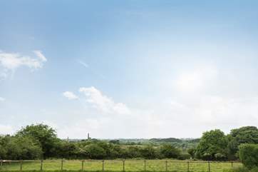 Countryside views surround the barns.