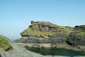 Boscastle's dog-leg harbour leads out to open sea.