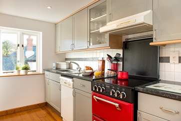 The kitchen is light and airy and well-equipped.