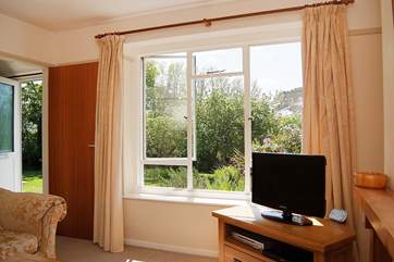 The sitting-room looks out onto the lovely garden.
