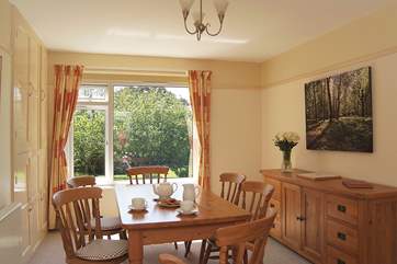 The dining-room also overlooks the pretty garden.