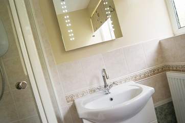 The mirror is lit by LED bulbs.