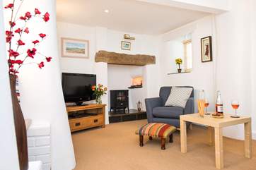 The sitting-room has an electic coal-effect fire.