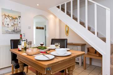 The stairs lead off from the dining-area.