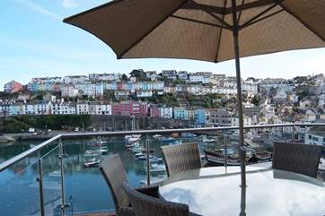 The first floor terrace looks out to Torbay and across the bustling harbour to the terraced cottages of Brixham above.