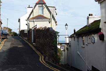 White Cottage is down the shallow steps - seen on the right.