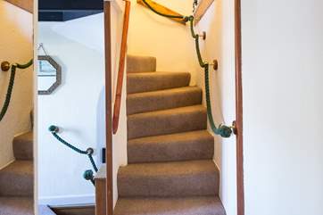 The narrow stairs going up to the second floor
