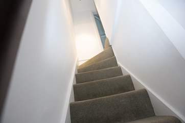 Steep cottage stairs lead up.