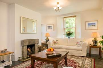 The sitting room has an open fire, making this an ideal retreat all year round