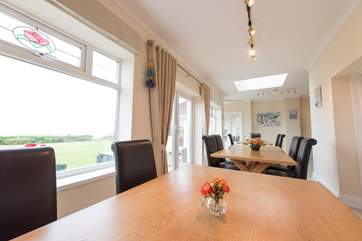 Three oak dining-tables can be pushed together for family feasts.