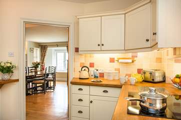Beautiful wooden floors run from the kitchen through to the dining room