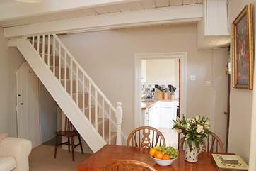 A typically steep cottage staircase leads up to the first floor.