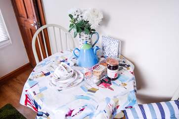 A cream tea waits on arrival.