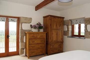 The master bedroom looks out over acres of farmland (Bedroom 1).
