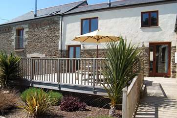 There is a raised deck outside the living-room and ground floor bedroom.