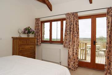 Doors lead out from the ground floor bedroom to the deck.