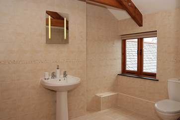 This spacious bathroom is en suite to Bedroom 2.