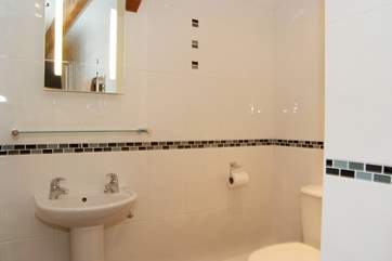 The fully tiled shower-room.