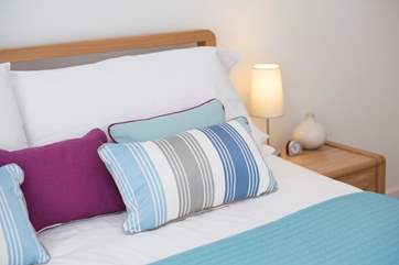 Stylish soft furnishings throughout.