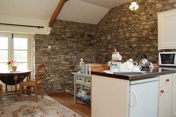 The dining-area looks out over the garden and meadows.