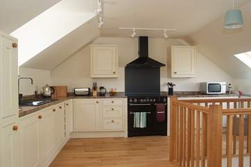 Oak flooring and a bespoke staircase and banisters show the quality of the cottage.