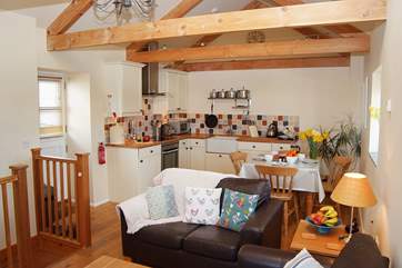 The open plan living-room is a sociable space to relax or dine.